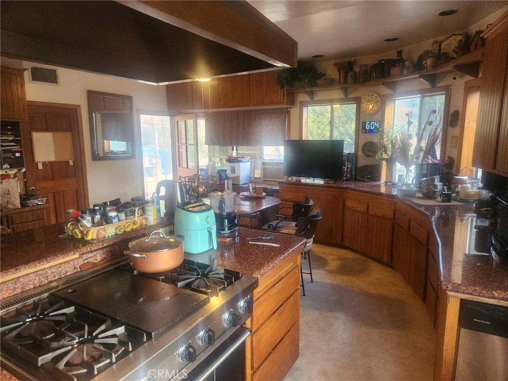 7404 Alpine Way Tujunga, CA 91042 - Photo 5 of 7 a kitchen with a stove and cabinets