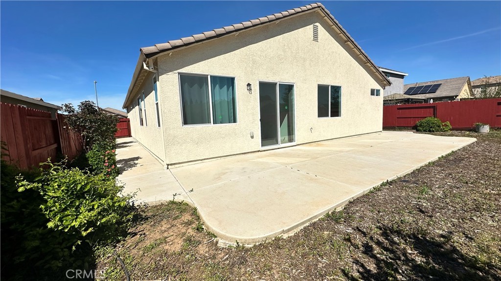 2428 Freestone Drive Merced, CA 95340 - Photo 15 of 18 Spacious backyard featuring a large concrete patio perfect for outdoor living