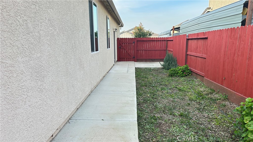 2428 Freestone Drive Merced, CA 95340 - Photo 5 of 18 Wide side yard access with room to expand. Concrete walkway wrap around.