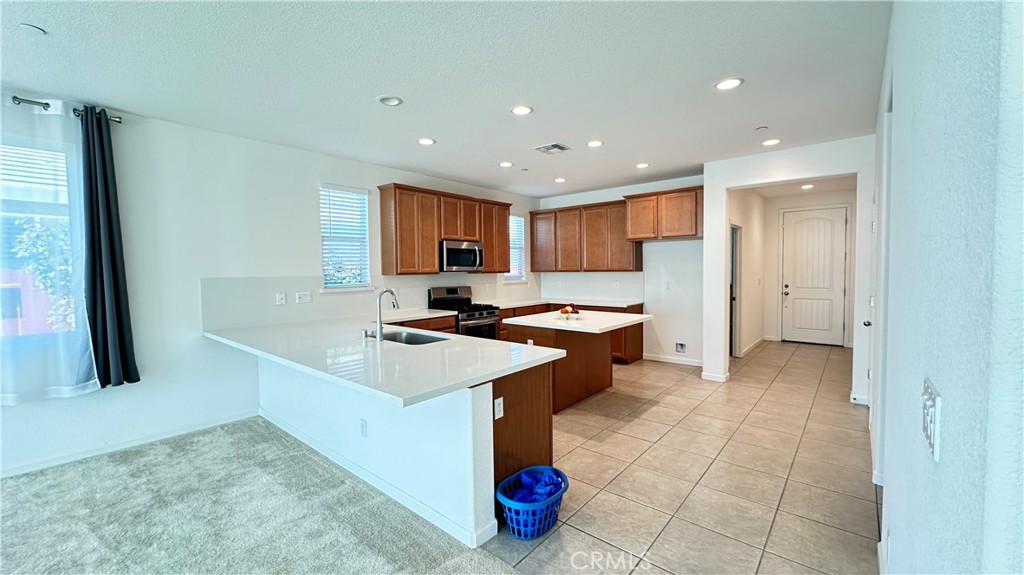 2428 Freestone Drive Merced, CA 95340 - Photo 6 of 18 Modern open concept layout connecting the gourmet kitchen to the spacious living area.