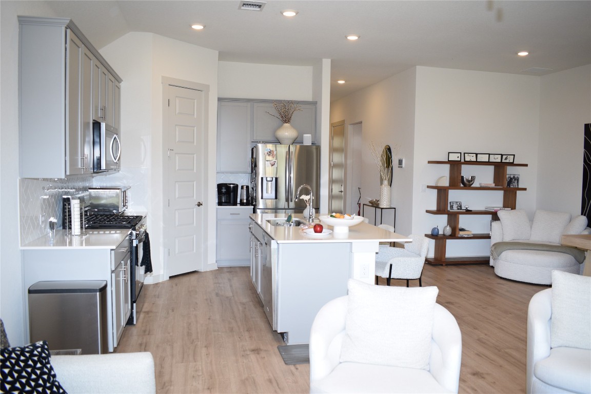 2409 Bear Cub Bend Leander, TX 78641 - Photo 37 of 37 a living room with furniture and a wooden floor