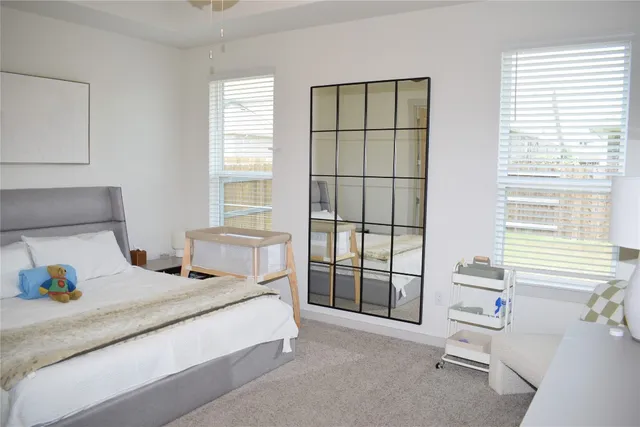 a metallic refrigerator freezer sitting in a kitchen