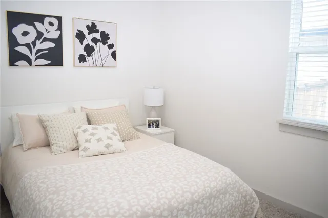 a white bath tub sitting next to a shower