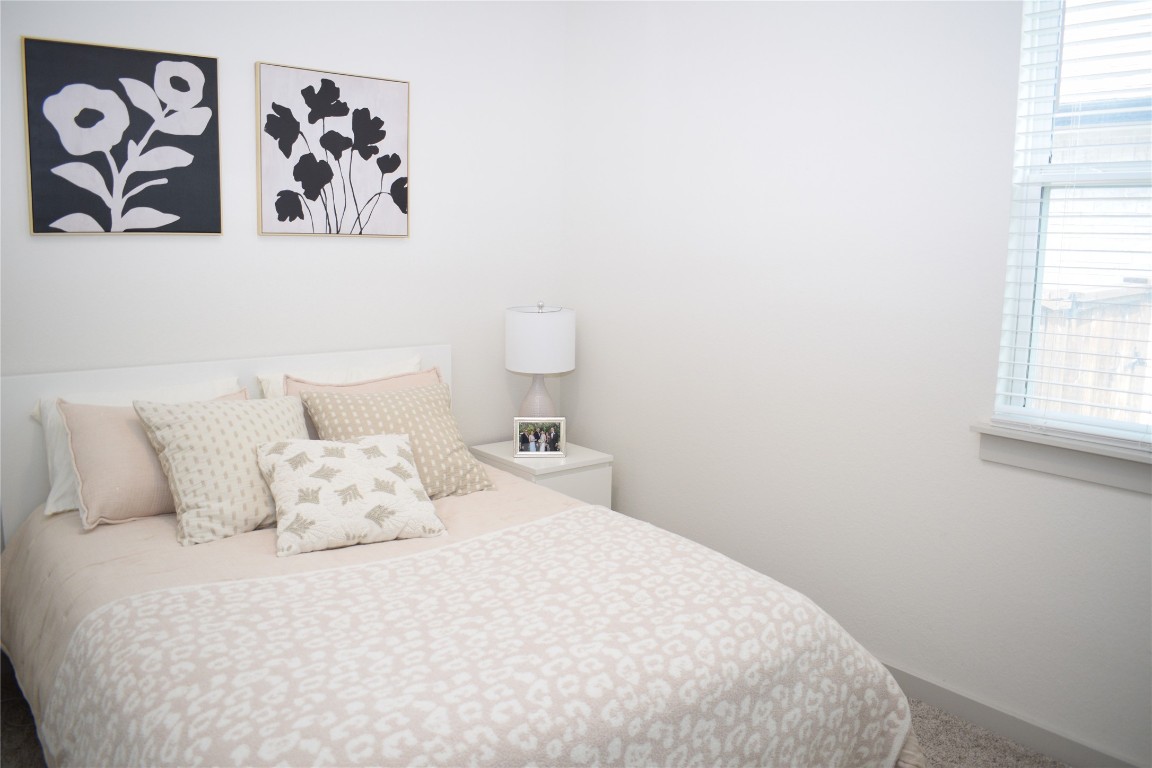 2409 Bear Cub Bend Leander, TX 78641 - Photo 16 of 37 a bedroom with a bed and wall painting