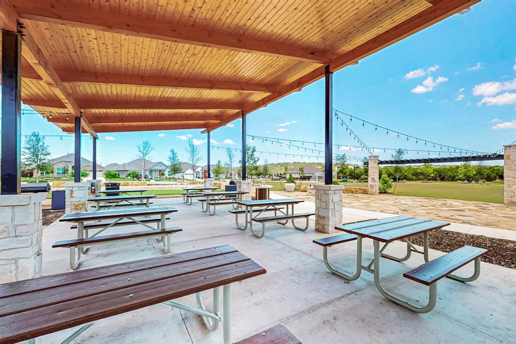 2409 Bear Cub Bend Leander, TX 78641 - Photo 29 of 37 a outdoor space with lots of tables and chairs