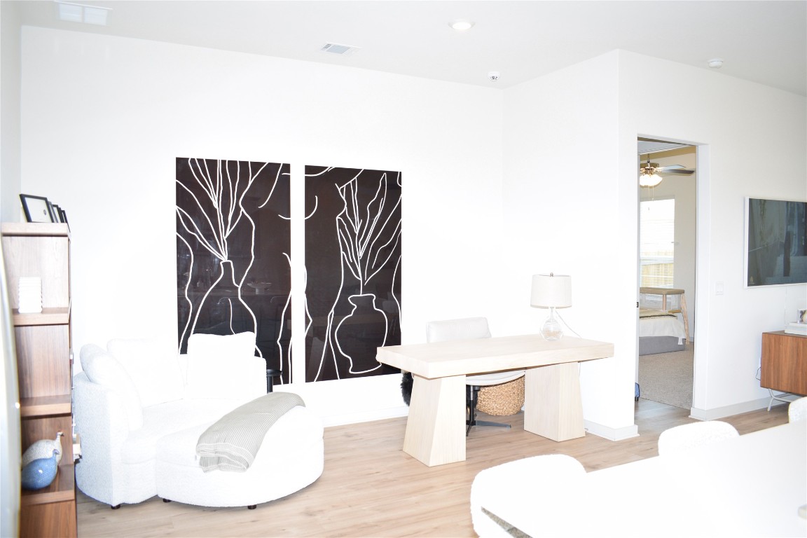 2409 Bear Cub Bend Leander, TX 78641 - Photo 4 of 37 a view of kitchen with furniture and wooden floor