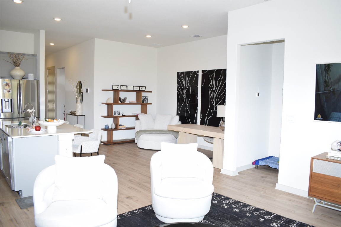 2409 Bear Cub Bend Leander, TX 78641 - Photo 8 of 37 a living room with furniture and a flat screen tv
