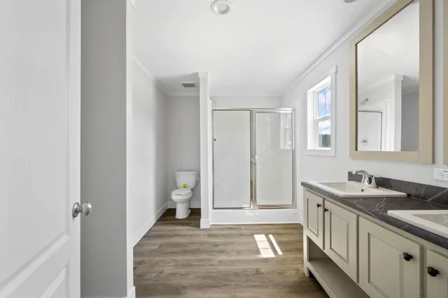 a bathroom with 2 sink and a mirror