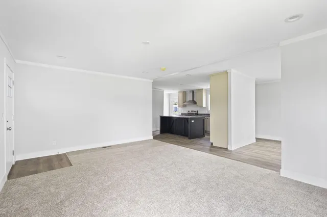 a view of kitchen and kitchen with sink