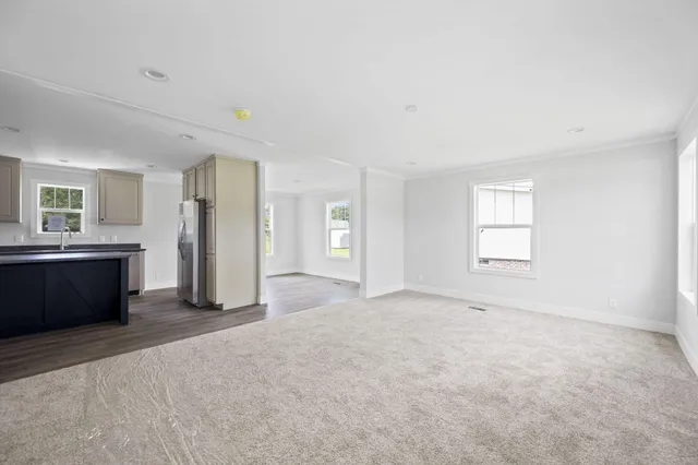 a kitchen with stainless steel appliances granite countertop a stove a refrigerator and a sink