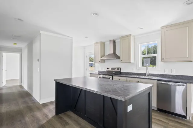 a view of a kitchen cabinets and wooden floor