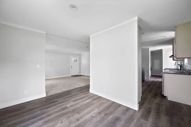 a view of an empty room and closet area