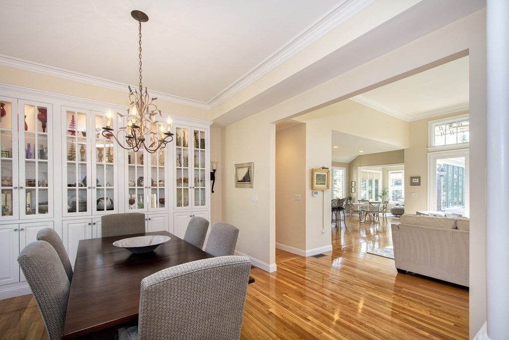 7 Tillinghast Drive, Unit 7 Hingham, MA 02043 - Photo 14 of 42 a living room with furniture and a chandelier