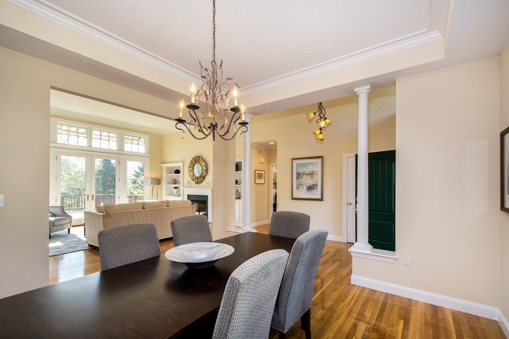7 Tillinghast Drive, Unit 7 Hingham, MA 02043 - Photo 15 of 42 a living room with furniture and a chandelier