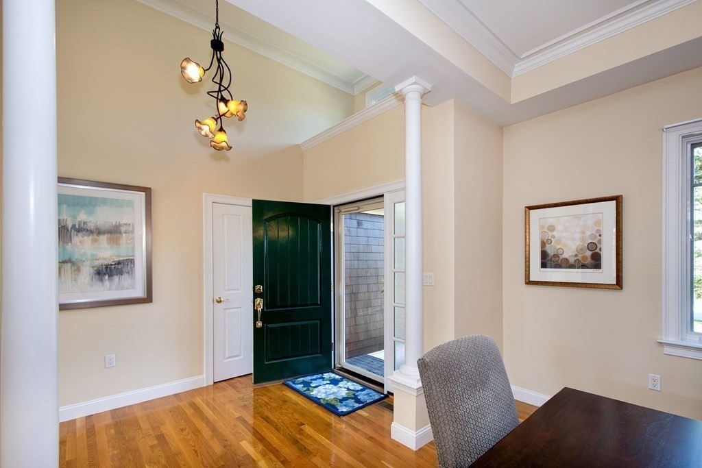 7 Tillinghast Drive, Unit 7 Hingham, MA 02043 - Photo 16 of 42 a bedroom with furniture and wooden floor