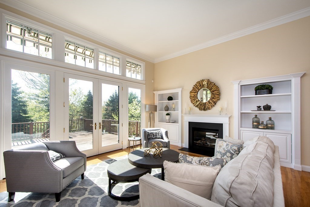 7 Tillinghast Drive, Unit 7 Hingham, MA 02043 - Photo 18 of 42 a living room with furniture large window and a fireplace