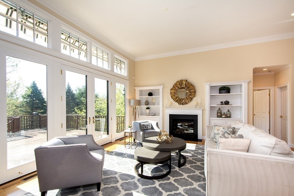 7 Tillinghast Drive, Unit 7 Hingham, MA 02043 - Photo 20 of 42 a living room with furniture fireplace and a large window