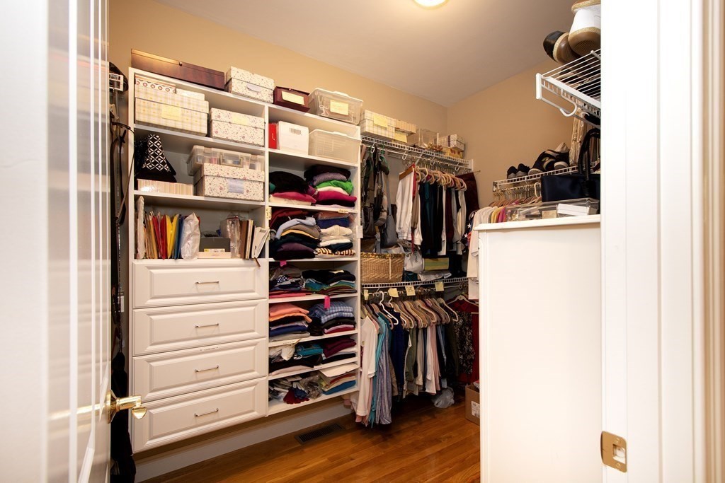 7 Tillinghast Drive, Unit 7 Hingham, MA 02043 - Photo 27 of 42 a view of walk in closet with clothes and shoes