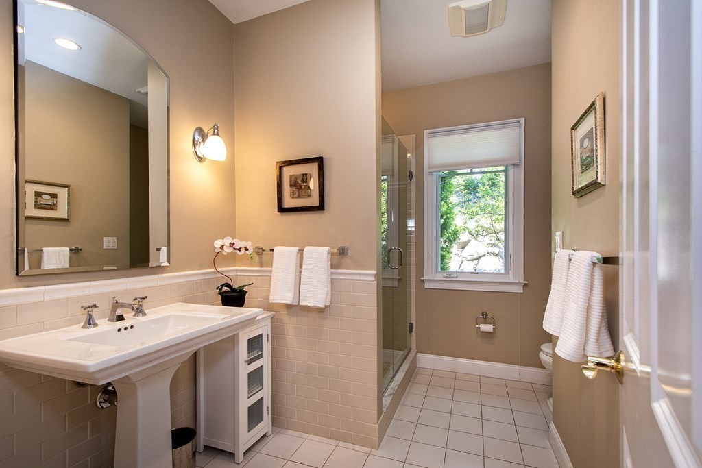 7 Tillinghast Drive, Unit 7 Hingham, MA 02043 - Photo 32 of 42 a bathroom with a sink and a mirror