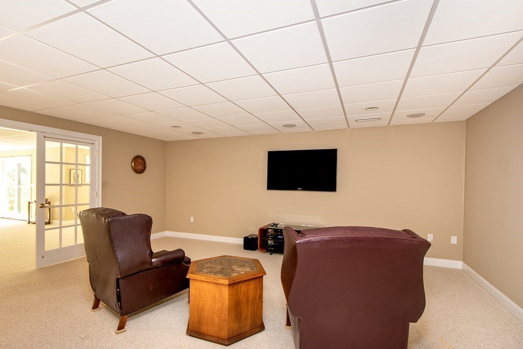 7 Tillinghast Drive, Unit 7 Hingham, MA 02043 - Photo 37 of 42 a living room with furniture and a flat screen tv