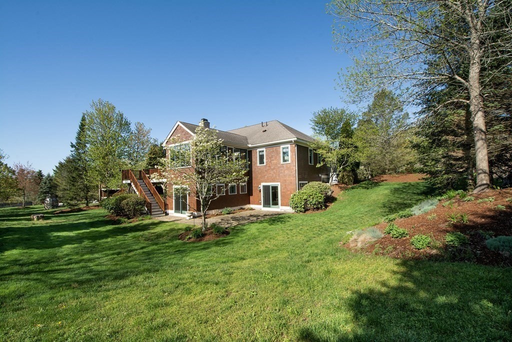 7 Tillinghast Drive, Unit 7 Hingham, MA 02043 - Photo 40 of 42 a front view of a house with garden