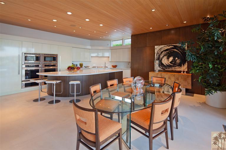 70205 Thunderbird Road Rancho Mirage, CA 92270 - Photo 11 of 25 a dining room with furniture and a potted plant