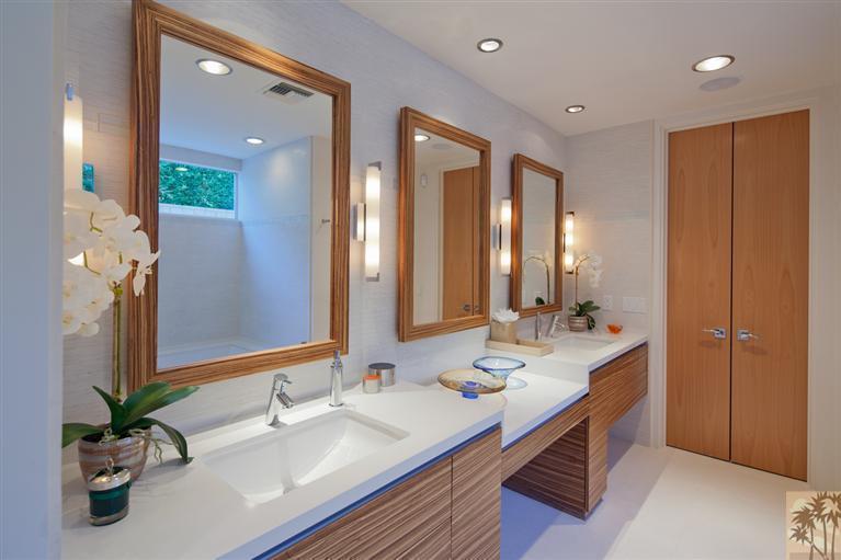 70205 Thunderbird Road Rancho Mirage, CA 92270 - Photo 18 of 25 a bathroom with double vanity sinks and a mirror