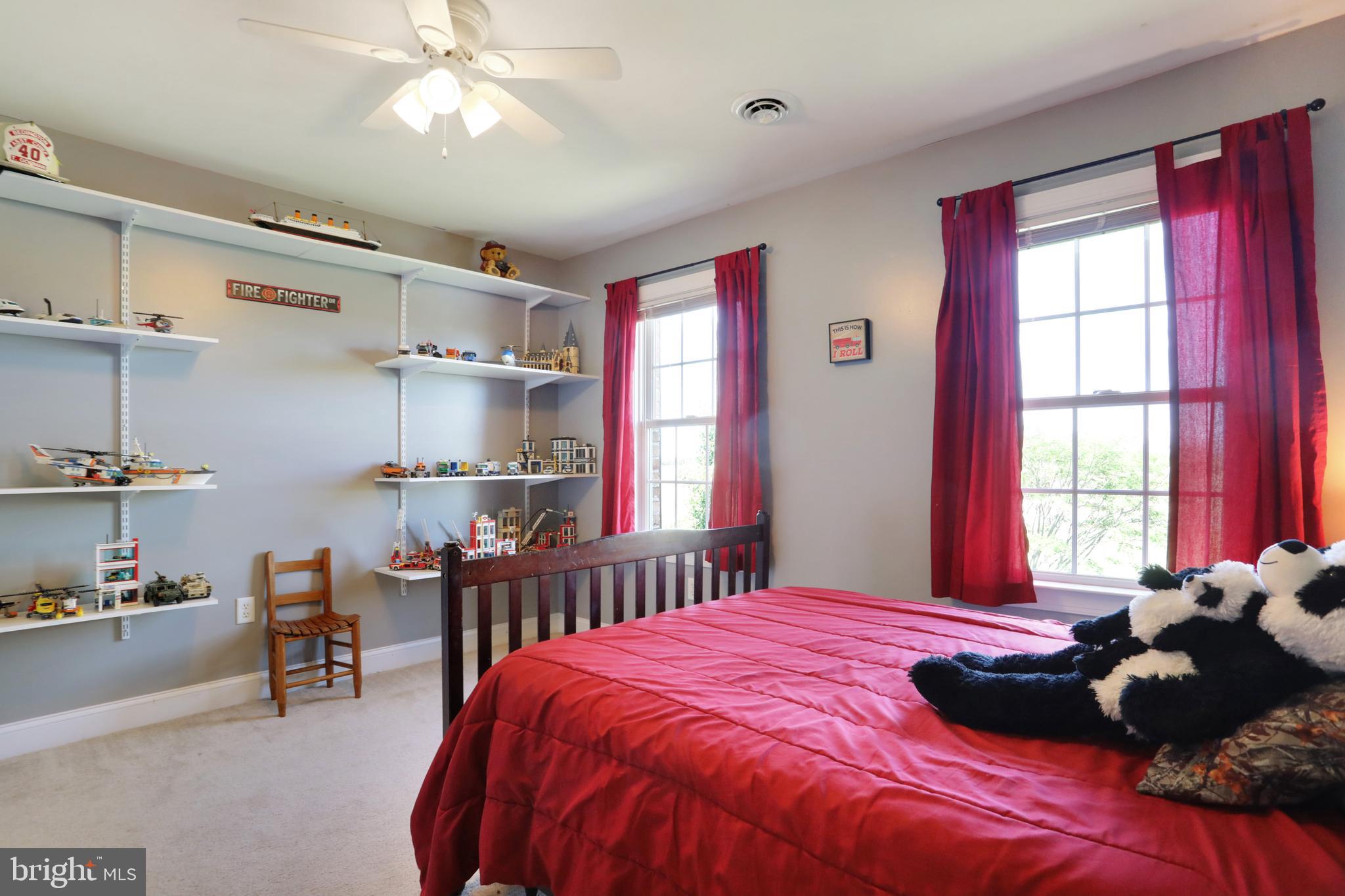 181 Co Rte 1/5 Falling Waters, WV 25419 - Photo 22 of 45 2nd floor bedroom; shelving conveys