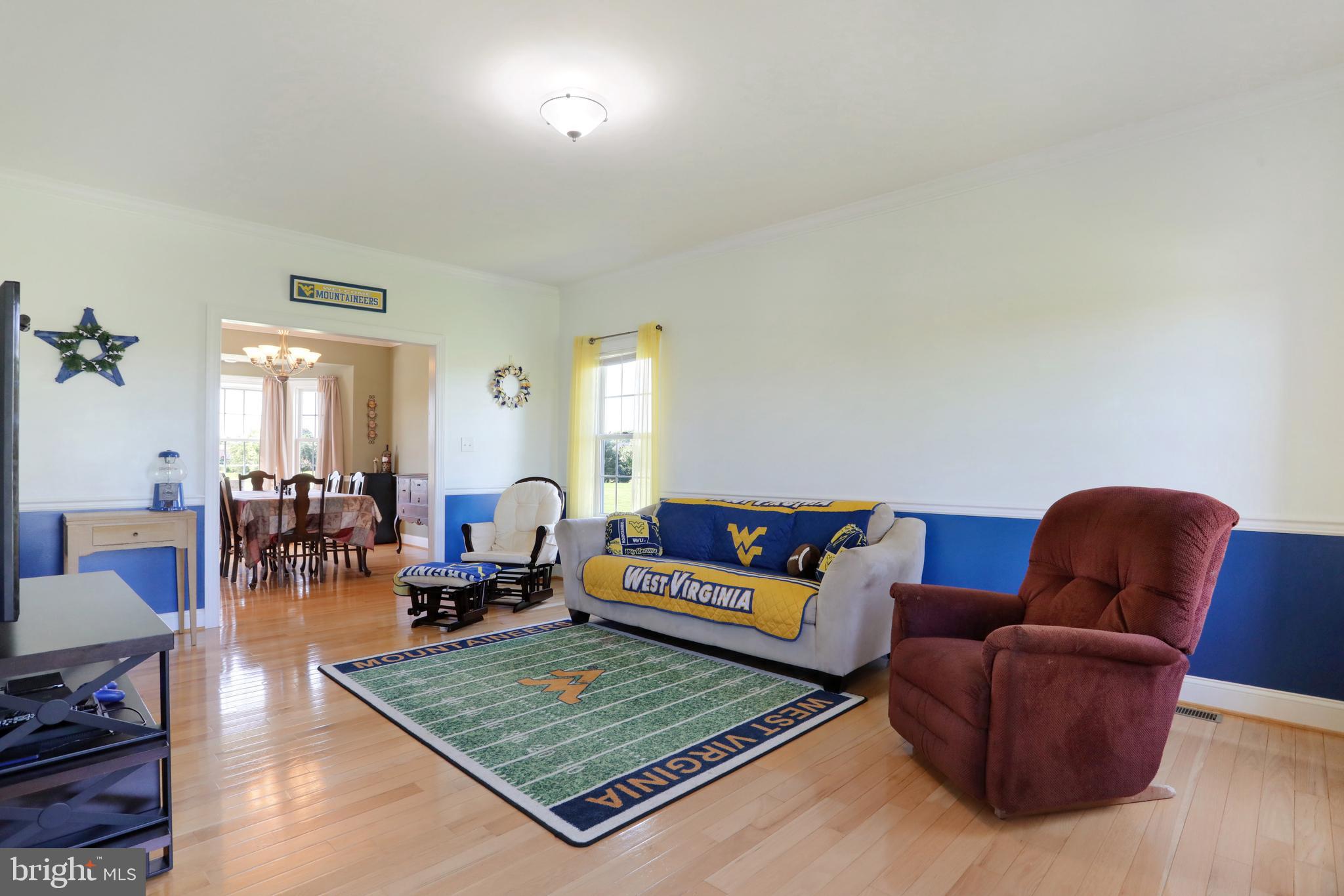 181 Co Rte 1/5 Falling Waters, WV 25419 - Photo 6 of 45 Main level family room; hardwood flooring