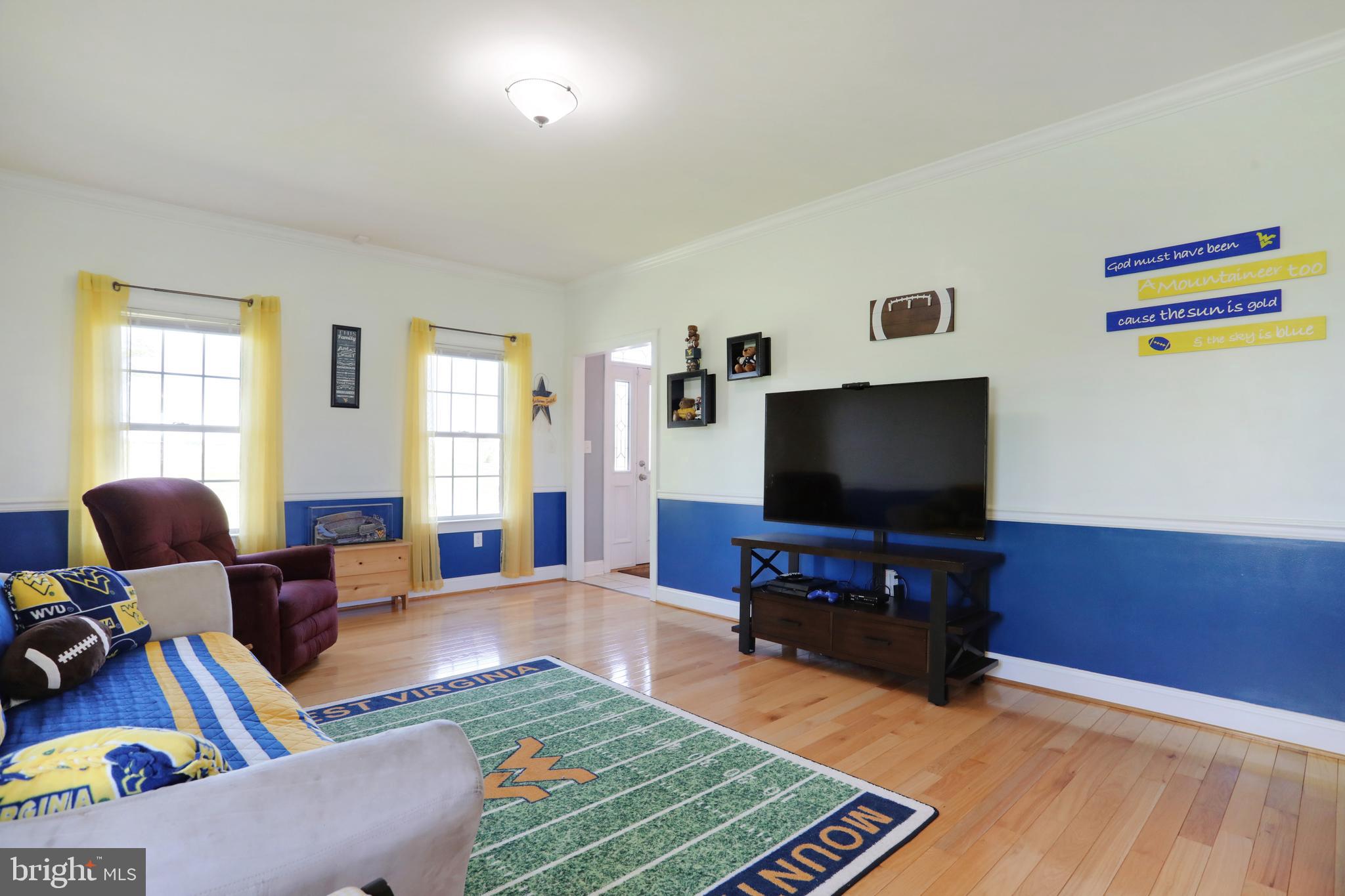 181 Co Rte 1/5 Falling Waters, WV 25419 - Photo 8 of 45 Family room; hardwood flooring