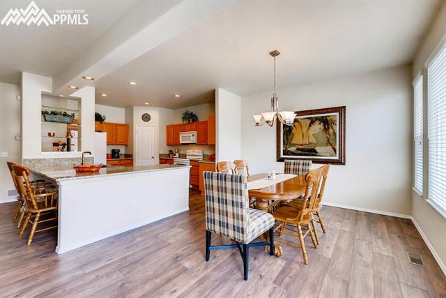 1944 Coldstone Way Colorado Springs, CO 80921 - Photo 9 of 23 Large dining area with updated lighting!