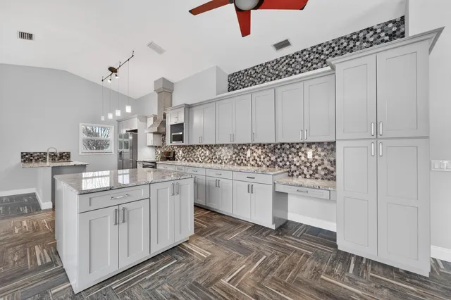 a kitchen with a stove and a sink