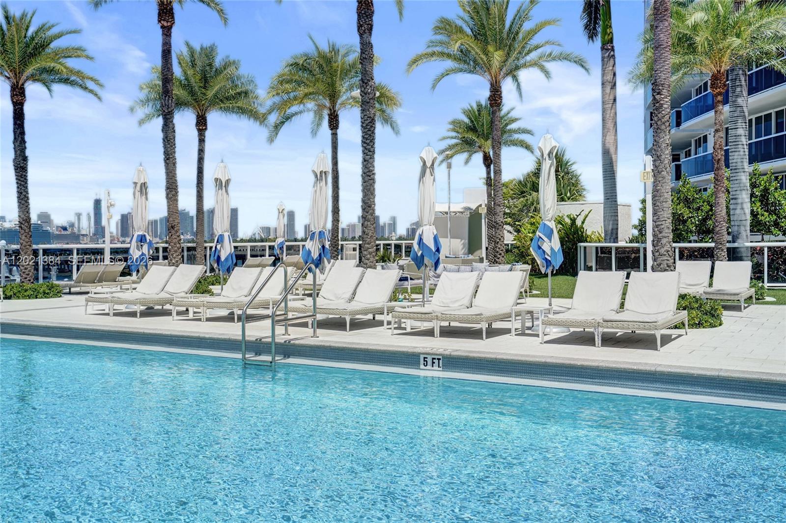 400 Alton Road, Unit PH11 Miami Beach, FL 33139 - Photo 11 of 49 a view of outdoor space with trees yard and swimming pool