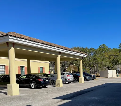 a view of a car park in front of house