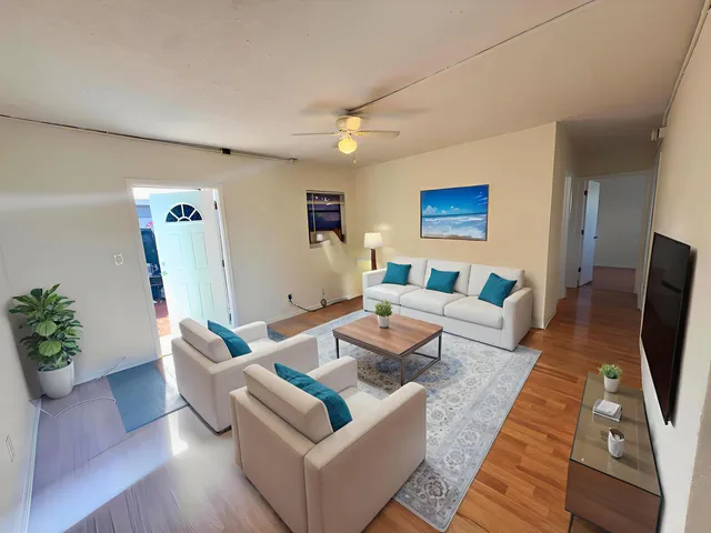 a living room with furniture fireplace and a flat screen tv