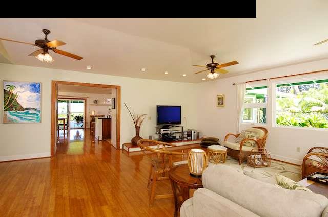 1011 Upper Ulumalu Road, Unit A Haiku, HI 96708 - Photo 13 of 30 a living room with furniture and a flat screen tv