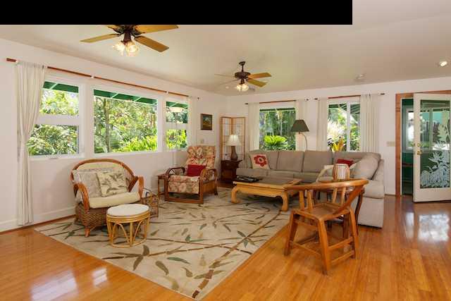 1011 Upper Ulumalu Road, Unit A Haiku, HI 96708 - Photo 16 of 30 a living room with furniture and a large window
