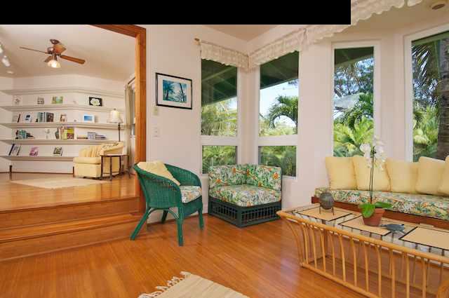 1011 Upper Ulumalu Road, Unit A Haiku, HI 96708 - Photo 18 of 30 a living room with furniture and a large window