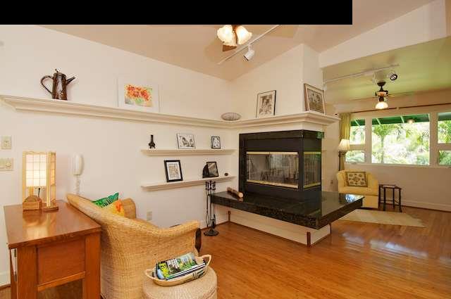 1011 Upper Ulumalu Road, Unit A Haiku, HI 96708 - Photo 19 of 30 a living room with furniture and a fireplace
