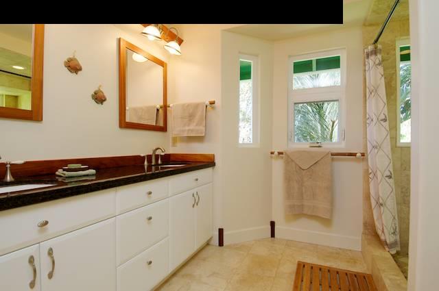 1011 Upper Ulumalu Road, Unit A Haiku, HI 96708 - Photo 21 of 30 a bathroom with a sink and a mirror