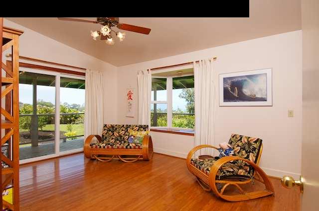 1011 Upper Ulumalu Road, Unit A Haiku, HI 96708 - Photo 23 of 30 a living room with furniture and a large window