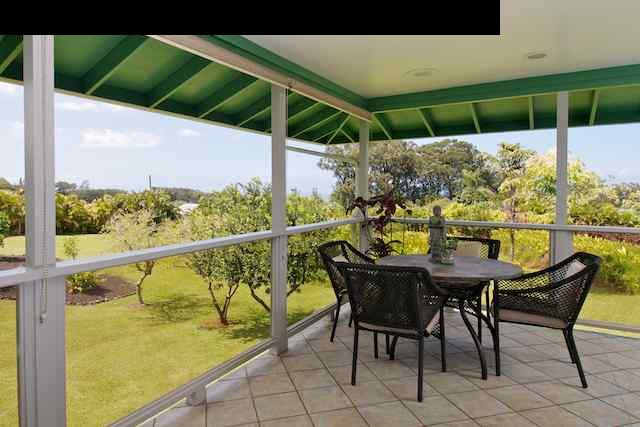 1011 Upper Ulumalu Road, Unit A Haiku, HI 96708 - Photo 24 of 30 a balcony with table and chairs
