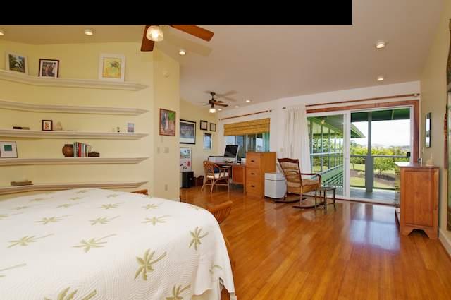 1011 Upper Ulumalu Road, Unit A Haiku, HI 96708 - Photo 6 of 30 a bed room with a bed and glass door