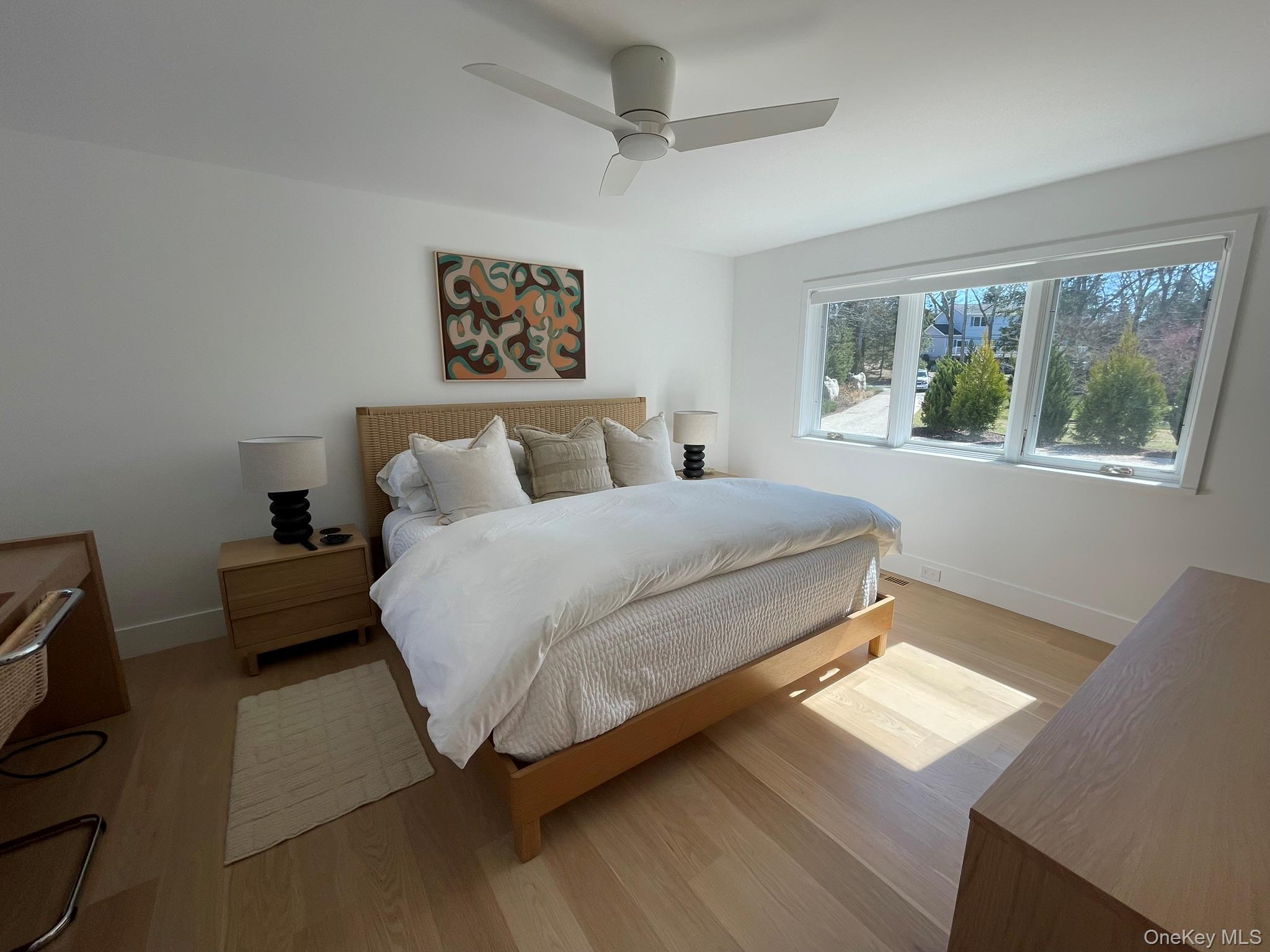 495 North Parish Drive Southold, NY 11971 - Photo 15 of 21 a bedroom with bed and a window