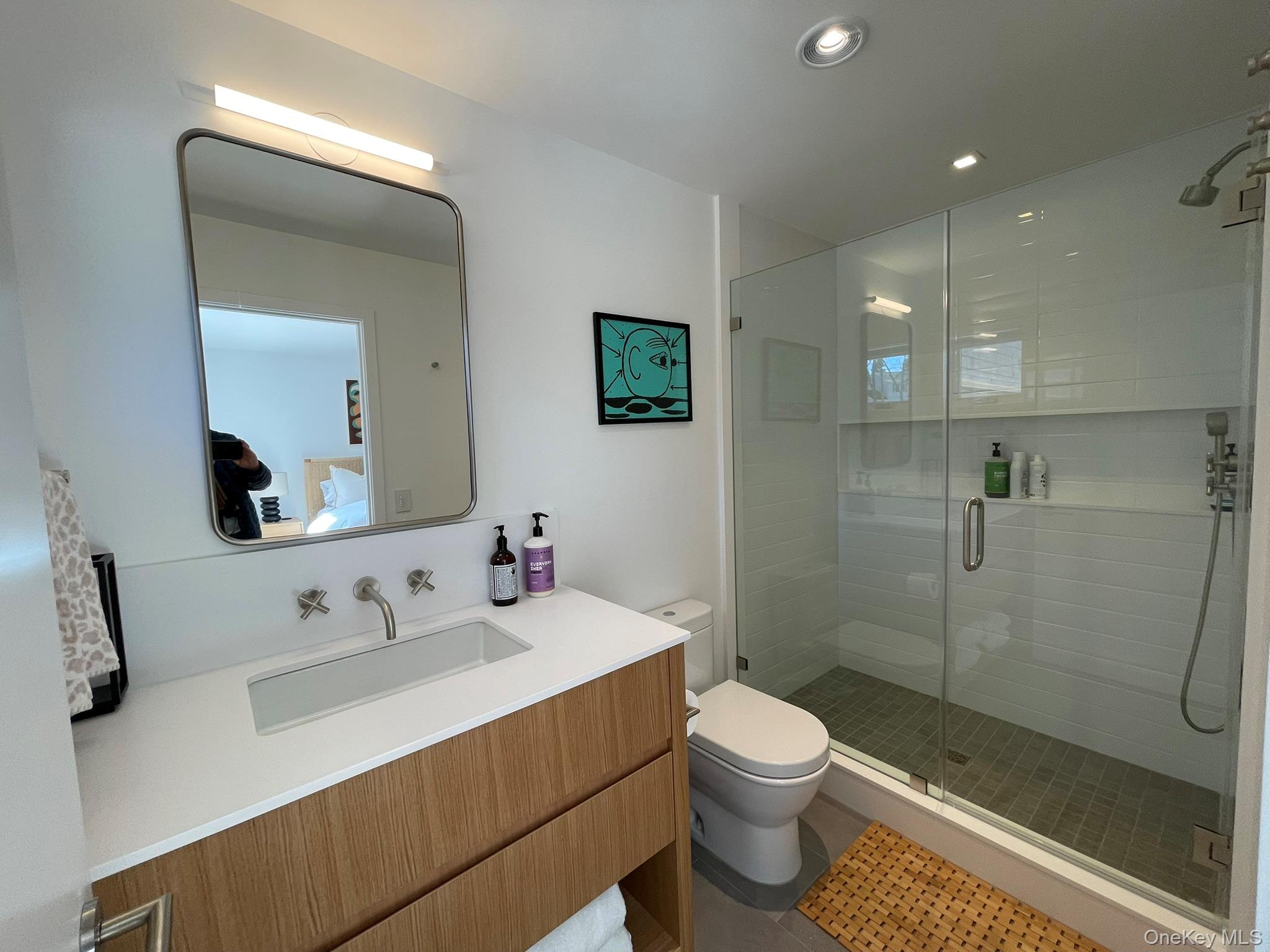 495 North Parish Drive Southold, NY 11971 - Photo 16 of 21 a bathroom with a sink a toilet and shower