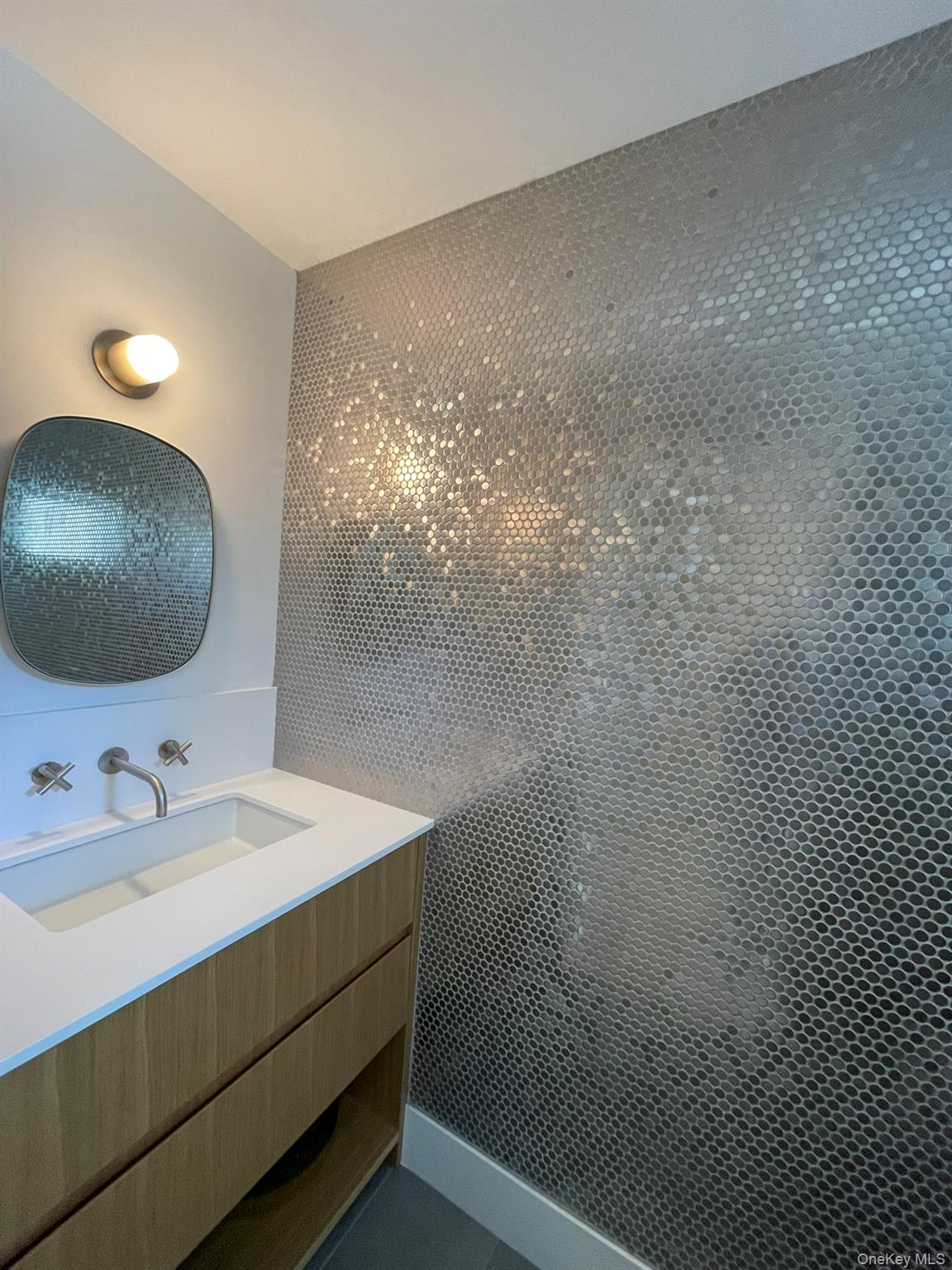 495 North Parish Drive Southold, NY 11971 - Photo 4 of 21 a bathroom with a sink and a mirror