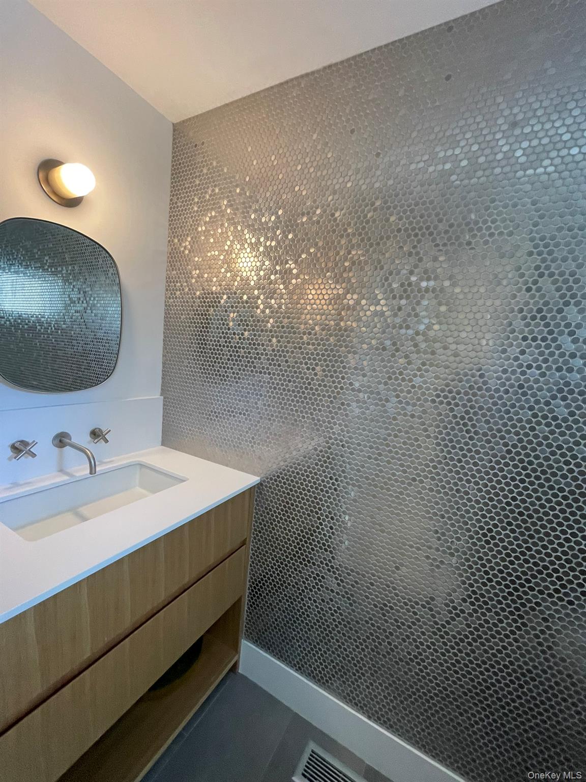 495 North Parish Drive Southold, NY 11971 - Photo 8 of 21 a bathroom with a sink and a mirror