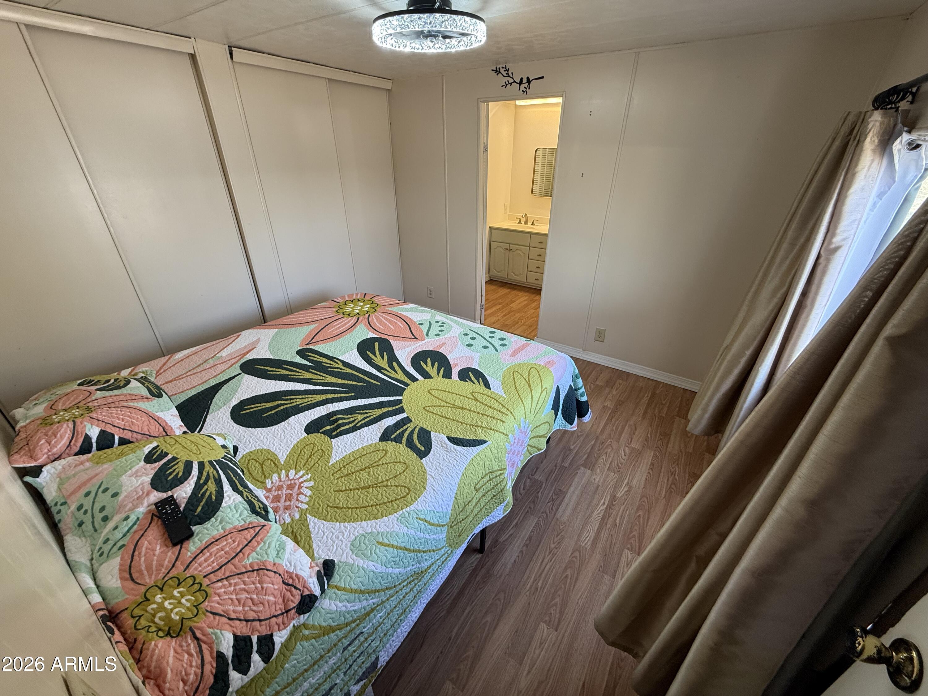 9501 East Broadway Road, Unit 48 Mesa, AZ 85208 - Photo 8 of 12 a bedroom with a bed and a window