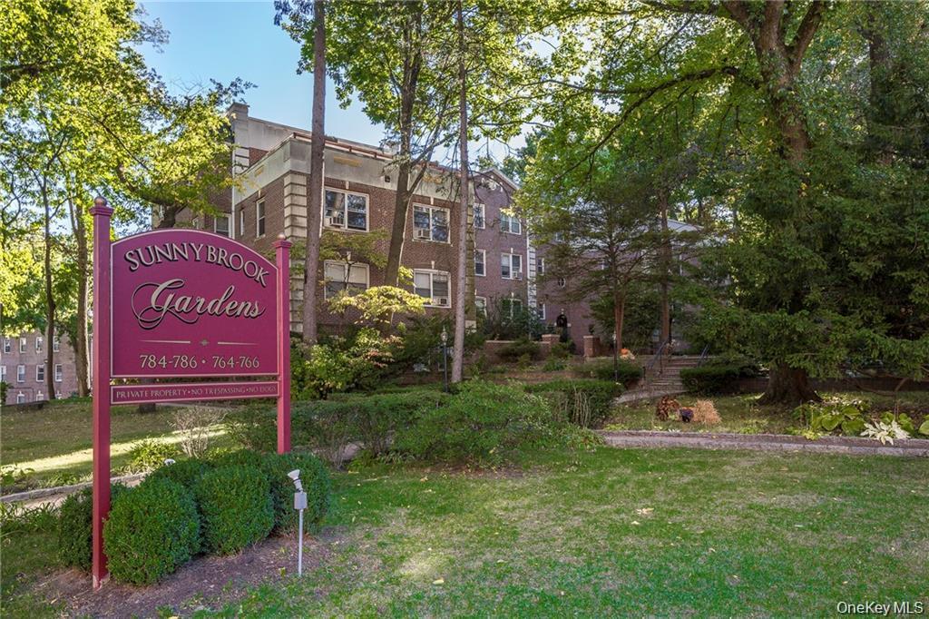 766 Palmer Road, Unit 2F Bronxville, NY 10708 - Photo 1 of 22 Community sign featuring a lawn