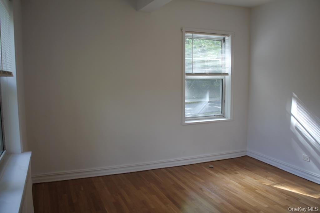 766 Palmer Road, Unit 2F Bronxville, NY 10708 - Photo 13 of 22 Spare room featuring light wood-style floors and baseboards